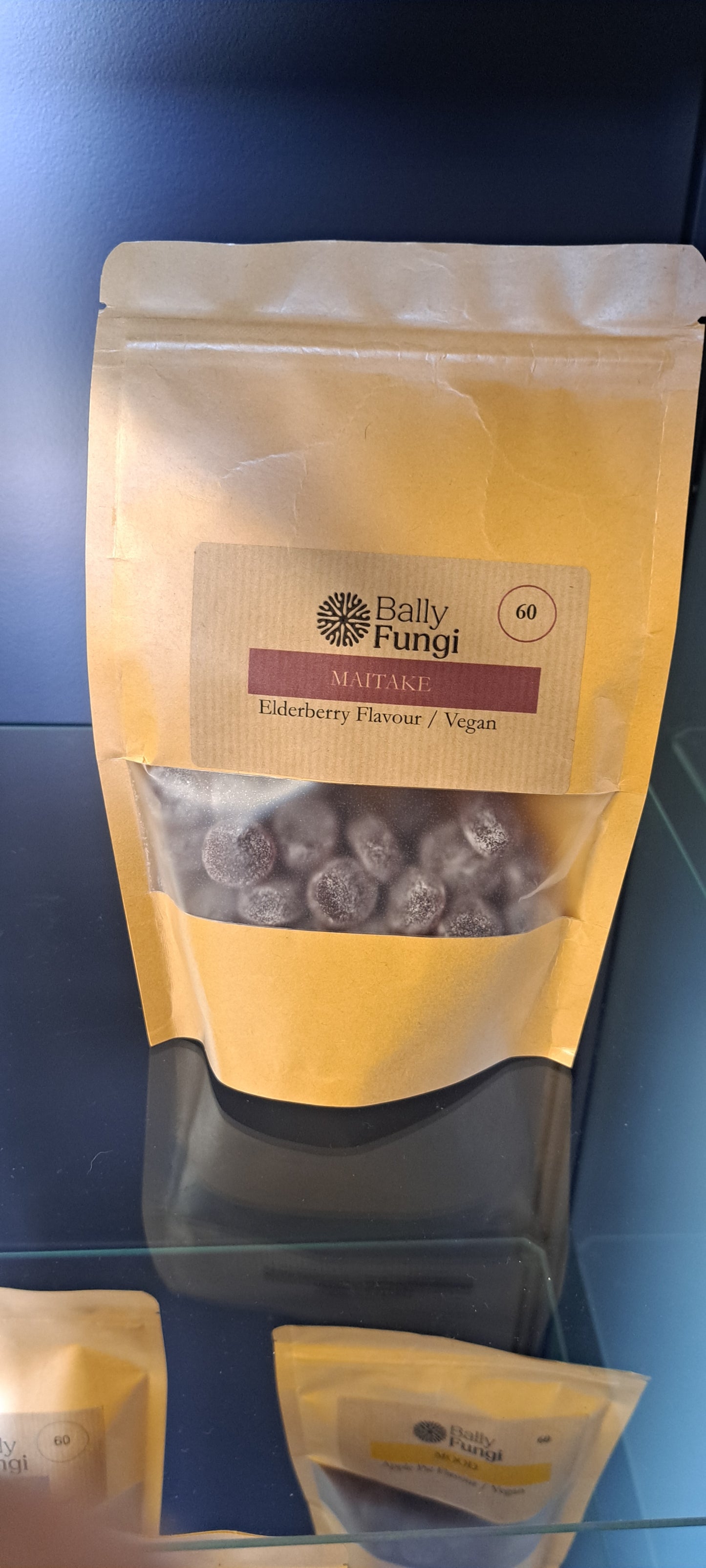 Bally Fungi Maitake Mushroom Gummies in elderberry flavor, packaged in a resealable brown pouch. Vegan-friendly and designed for immune support.